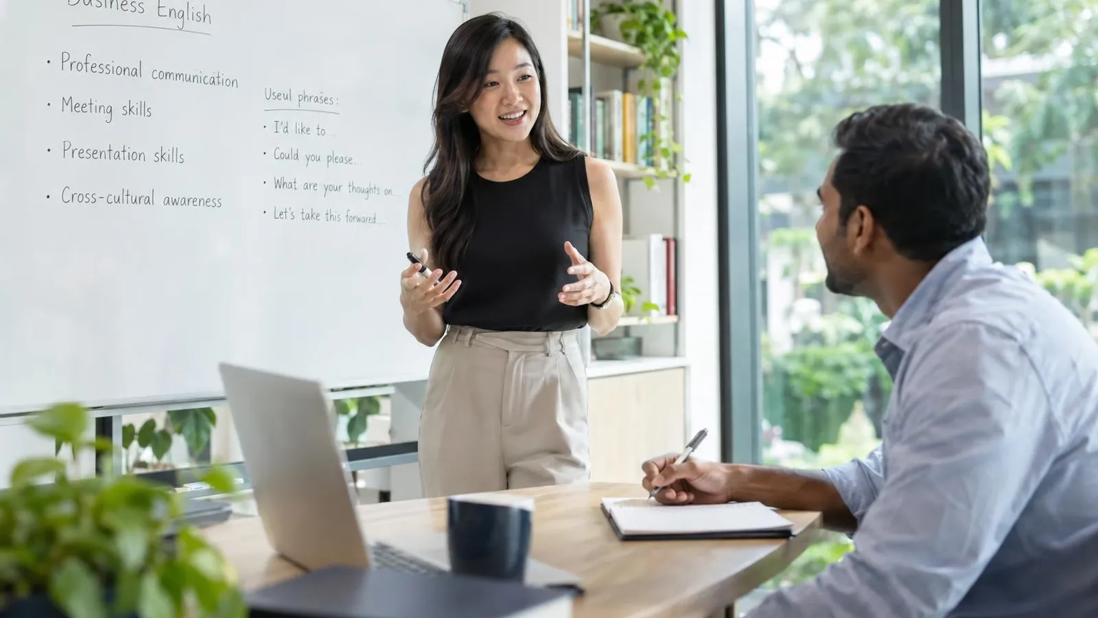 Business English Courses: a customer and a provider in a bright, modern setting