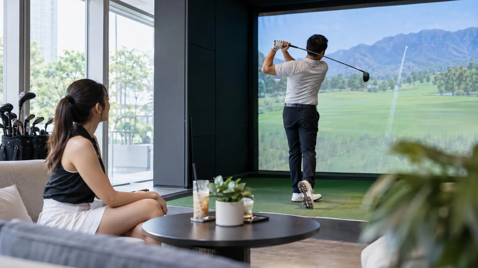 Indoor Golf Simulators: a customer and a provider in a bright, modern setting