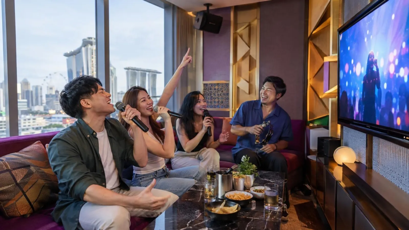 Friends singing in a private KTV karaoke room in Singapore