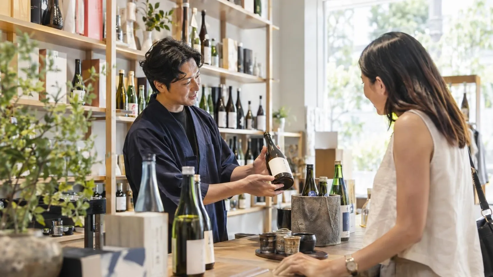 Sake Shops: a customer and a provider in a bright, modern setting