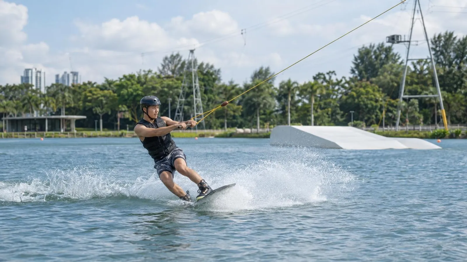 A wakeboarder riding behind a cable at a Singapore wake park