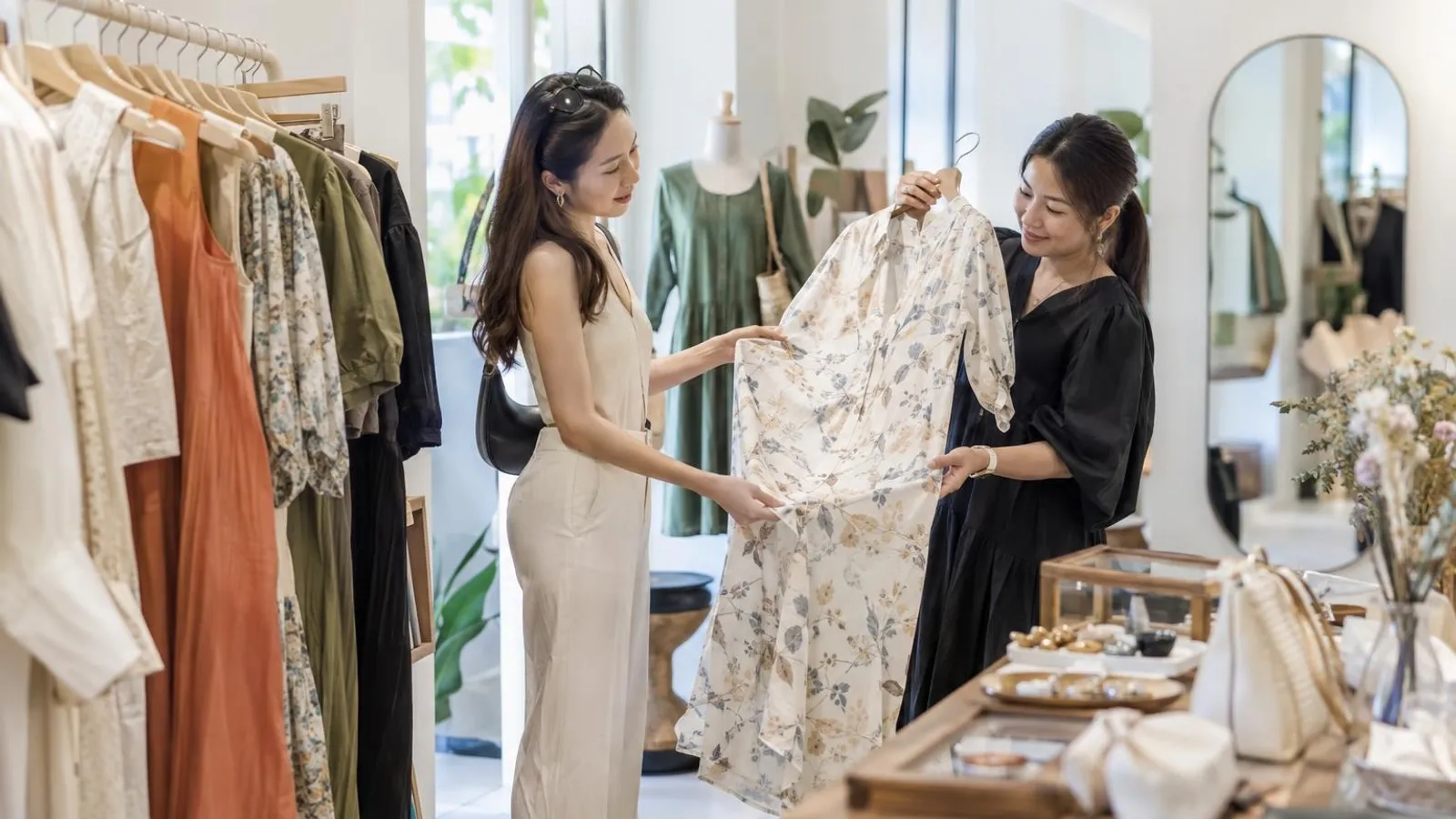Womens Fashion Boutiques: a customer and a provider in a bright, modern setting