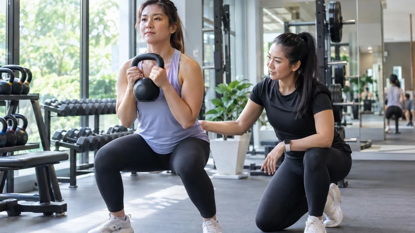 Women-Only Gyms and Studios: a customer and a provider in a bright, modern setting